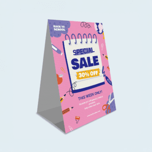 Folded corflute a-frame sign promoting a sale at a retail store