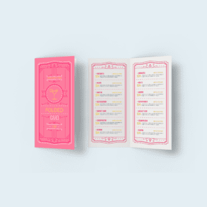 Pink cocktail menu on folded card on a plain background