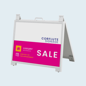 White A-frame corflute sign with pink and white design advertising a luxury residences sale, including contact details for appointments.